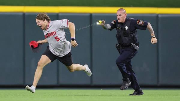 Fan runs onto field, does backflip before getting tased during Reds game